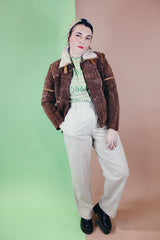 Women's vintage 1970's Ms. Pioneer label long sleeve brown suede short zip up jacket with cream faux fur trim on collar.
