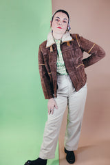 Women's vintage 1970's Ms. Pioneer label long sleeve brown suede short zip up jacket with cream faux fur trim on collar.