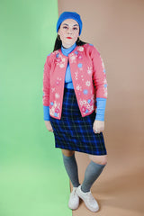 Women's vintage 1950's Gene Shelly's Miss Boutique California label 3/4 arm length open front pink cardigan sweater in wool material with blue, white, and pink embroidered flowers all over