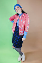 Women's vintage 1950's Gene Shelly's Miss Boutique California label 3/4 arm length open front pink cardigan sweater in wool material with blue, white, and pink embroidered flowers all over