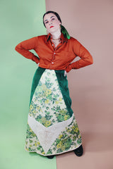 Women's vintage 1970's Chelsea Davis label a line shaped maxi skirt in a patchwork quilted print. Green velvet with white and green floral patches.