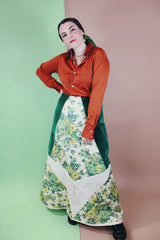 Women's vintage 1970's Chelsea Davis label a line shaped maxi skirt in a patchwork quilted print. Green velvet with white and green floral patches.