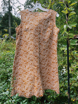 sleeveless brown and cream printed romper with zipper in the back short length women's vintage 1960's