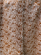 sleeveless brown and cream printed romper with zipper in the back short length women's vintage 1960's