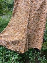 sleeveless brown and cream printed romper with zipper in the back short length women's vintage 1960's