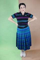 Women's vintage 1980's Le Tigre, Made in USA label short sleeve striped polo t-shirt with a black ribbed collar and two button half closure.