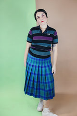 Women's vintage 1980's Le Tigre, Made in USA label short sleeve striped polo t-shirt with a black ribbed collar and two button half closure.