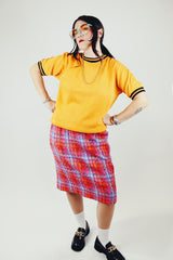 short sleeve orange pullover crew neck with navy striped trim around cuffs and neck vintage 1970's