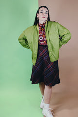 Men's or women's vintage 1960's Puritan Gary Player Sportswear, Made in USA label long sleeve olive green lightweight nylon bomber jacket with a zipper in the front.