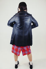 long sleeve black leather long jacket with double lapel, buttons, and white thread detail vintage 1970's
