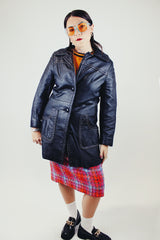 long sleeve black leather long jacket with double lapel, buttons, and white thread detail vintage 1970's