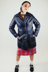 long sleeve black leather long jacket with double lapel, buttons, and white thread detail vintage 1970's