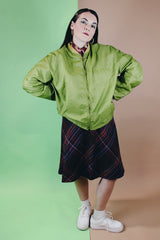 Men's or women's vintage 1960's Puritan Gary Player Sportswear, Made in USA label long sleeve olive green lightweight nylon bomber jacket with a zipper in the front.