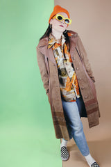 Women's vintage 1970's New England Sportswear Company label long length brown suede and leather trench coat that buttons up the front.