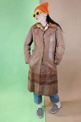 Women's vintage 1970's New England Sportswear Company label long length brown suede and leather trench coat that buttons up the front.