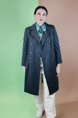 Women's vintage 1960's long sleeve cotton double breasted trench coat in a grey green color.