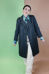 Women's vintage 1960's long sleeve cotton double breasted trench coat in a grey green color.
