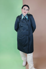Women's vintage 1960's long sleeve cotton double breasted trench coat in a grey green color.