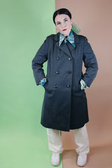 Women's vintage 1960's long sleeve cotton double breasted trench coat in a grey green color.