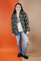 Women's vintage 1970's Hand Fashion long sleeve polyester blouse with a collar and gold buttons. Blue, white, and yellow paisley all over print.