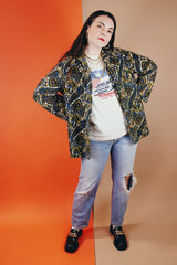 Women's vintage 1970's Hand Fashion long sleeve polyester blouse with a collar and gold buttons. Blue, white, and yellow paisley all over print.