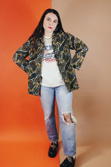 Women's vintage 1970's Hand Fashion long sleeve polyester blouse with a collar and gold buttons. Blue, white, and yellow paisley all over print.