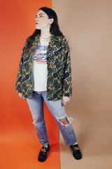 Women's vintage 1970's Hand Fashion long sleeve polyester blouse with a collar and gold buttons. Blue, white, and yellow paisley all over print.