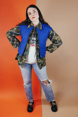 Women's vintage medium 1980's SKYR by Hertha Amen label sleeveless capped sleeved short length zip up bright blue Nylon ski vest with red and green stripes on the sides.