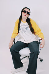 long sleeve vintage baseball tee cream body with yellow arms 1976 tower records graphic on front and back