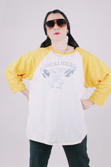 long sleeve vintage baseball tee cream body with yellow arms 1976 tower records graphic on front and back