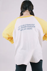 long sleeve vintage baseball tee cream body with yellow arms 1976 tower records graphic on front and back