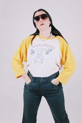 long sleeve vintage baseball tee cream body with yellow arms 1976 tower records graphic on front and back
