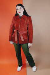 Women's vintage 1970's Genuine Leather, Made in Uruguay label burn orange suede leather zip up jacket with collar and matching tie belt and a faux fur liner