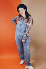 Men's vintage 1970's JCPenney label long sleeve button up shirt with a pointy collar in a slinky and lightweight Polyester material. Light blue, grey, and terracotta all over abstract print.