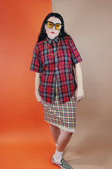 Women's or men's vintage 1970's Golden Award short sleeve plaid print button up shirt with pointy collar. Polyester cotton blend material in a red, black, white, and yellow plaid print.