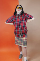 Women's or men's vintage 1970's Golden Award short sleeve plaid print button up shirt with pointy collar. Polyester cotton blend material in a red, black, white, and yellow plaid print.