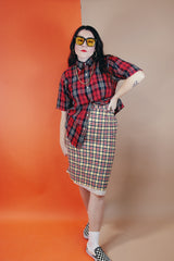 Women's vintage 1970's high waisted midi length pencil skirt in cream with yellow, red, and black plaid print in a wool material