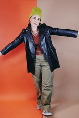 Women's vintage 1970's Adler Leather, Made in California label long sleeve black leather jacket with a double breasted closure