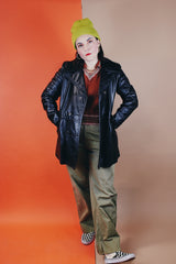 Women's vintage 1970's Adler Leather, Made in California label long sleeve black leather jacket with a double breasted closure