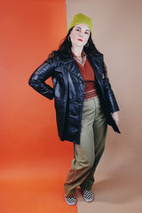 Women's vintage 1970's Adler Leather, Made in California label long sleeve black leather jacket with a double breasted closure