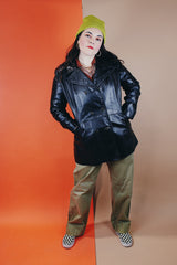 Women's vintage 1970's Adler Leather, Made in California label long sleeve black leather jacket with a double breasted closure