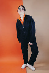 Women's or men's vintage 1980's Reminiscence by Stewart Richer label zip up one piece jumpsuit in a black cotton material.