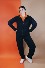 Women's or men's vintage 1980's Reminiscence by Stewart Richer label zip up one piece jumpsuit in a black cotton material.