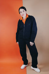 Women's or men's vintage 1980's Reminiscence by Stewart Richer label zip up one piece jumpsuit in a black cotton material.