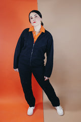 Women's or men's vintage 1980's Reminiscence by Stewart Richer label zip up one piece jumpsuit in a black cotton material.