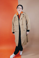 Women's vintage 1960's Dumas label 100% Mongolian camel hair coat in light tan colored with a double breasted closure, double lapel, and two pockets