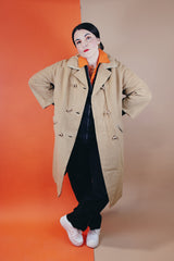 Women's vintage 1960's Dumas label 100% Mongolian camel hair coat in light tan colored with a double breasted closure, double lapel, and two pockets