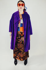 purple velvet coat with 3/4 arm length buttons up the front and attached neck tie vintage women's 1960's