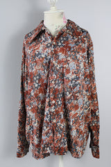 Men's vintage 1970's JCPenney label long sleeve button up shirt with a pointy collar in a slinky and lightweight Polyester material. Light blue, grey, and terracotta all over abstract print.