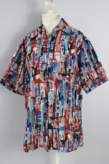 Men's or women's vintage 1970's Joel California label short sleeve button up shirt with a pointy collar. Lightweight polyester material in blue, grey, black, and salmon colored abstract print.